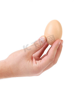 手拿着一个白色鸡蛋