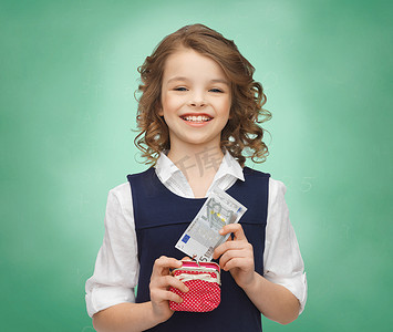 放进口袋摄影照片_有钱包和纸币的愉快的女孩
