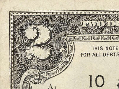 美钞摄影照片_白色的两美元钞票特写