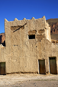 文化墙村摄影照片_摩洛哥建筑村砖墙中的非洲山