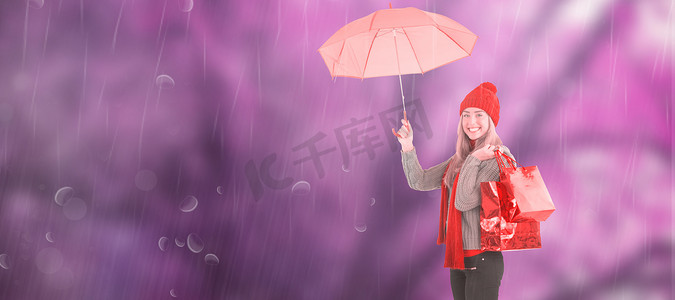 节日金发女郎拿着雨伞和袋子的合成图像