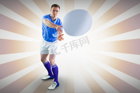 竞技设计摄影照片_橄榄球运动员投掷橄榄球的合成图像