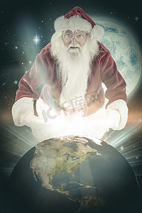 满月喜摄影照片_圣诞老人的合成图像打开他的红色包
