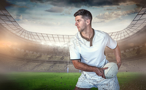 将球放在一边的橄榄球运动员的合成图像