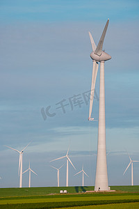 电力客服摄影照片_用于电力生产的风车荷兰弗莱福兰，海上风力涡轮机农场，生产绿色能源的风车农场