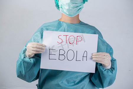 穿安全服的科学家持有停止埃博拉埃博拉病毒概念