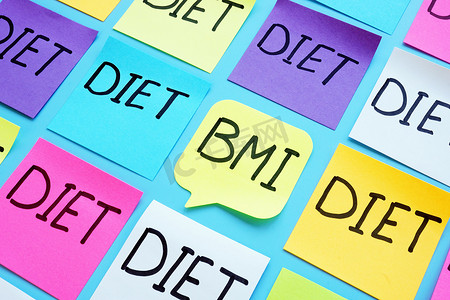 健康指数摄影照片_BMI 体重指数和五颜六色的床单上的单词饮食。
