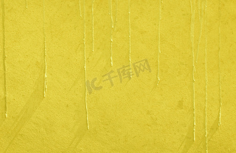 黄色油漆滴墙纹理背景
