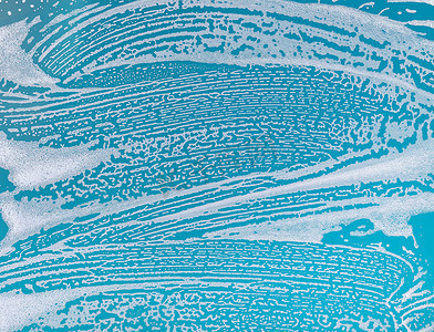 在蓝色背景的肥皂泡沫