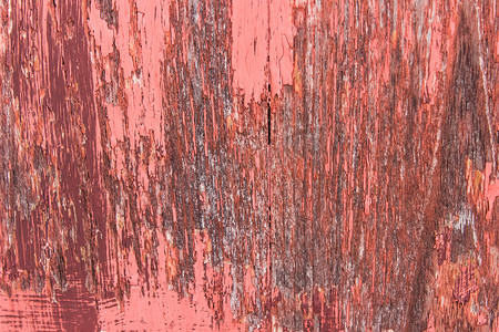 特写红色木头剥落的油漆