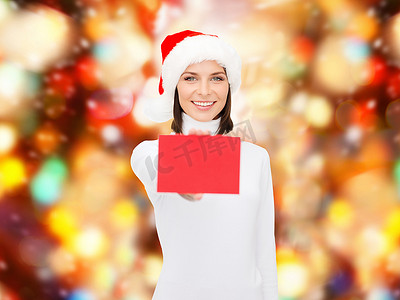 带着空白红卡的圣诞老人助手帽的女人