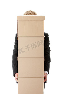 堆叠纸箱摄影照片_商人与堆叠的盒子