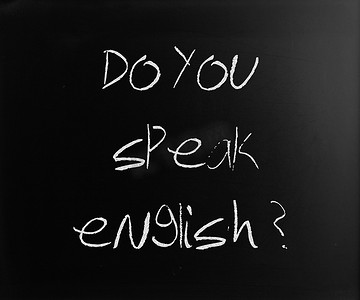 写英语摄影照片_“你会说英语吗”用白色粉笔在黑板上手写