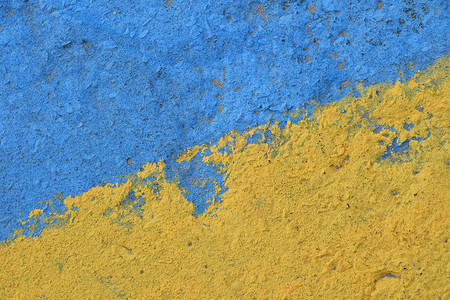 蓝色和黄色彩绘混凝土墙体纹理