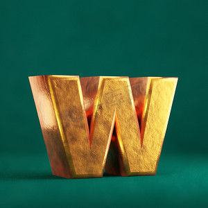 金色字母摄影照片_潮水绿色背景上的 Fortuna 金色字母 W 小写。