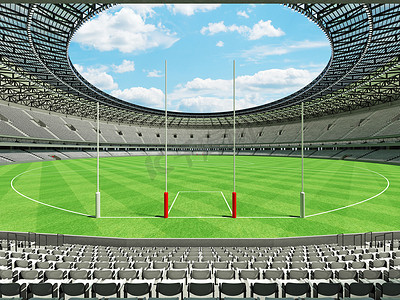 垂直俯拍足球场摄影照片_美丽的现代圆形澳式足球场，设有白色座椅和贵宾包厢