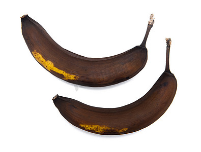 坏的食物摄影照片_孤立在白色背景上的烂香蕉
