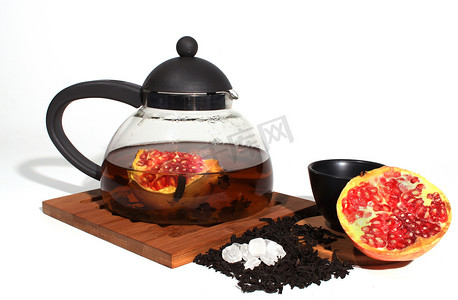 水果茶壶摄影照片_茶和水果