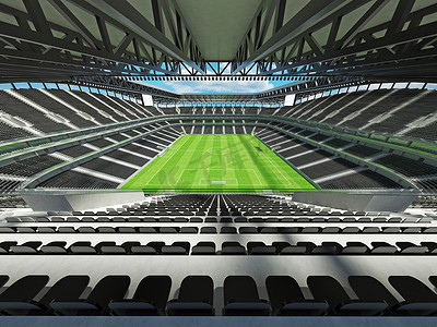 垂直俯拍足球场摄影照片_有黑位子和贵宾包厢的大美丽的现代足球场