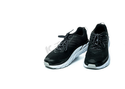 鞋子背景摄影照片_在白色背景隔绝的对新的跑鞋。