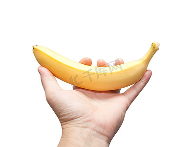 白色背景中手中的成熟香蕉