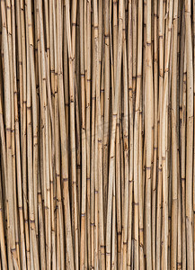 稻草背景摄影照片_旧干稻草背景，竹墙纹理。