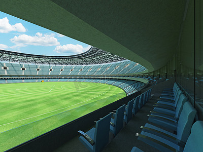 美丽的现代圆形澳式足球场，设有天蓝色座椅和贵宾包厢