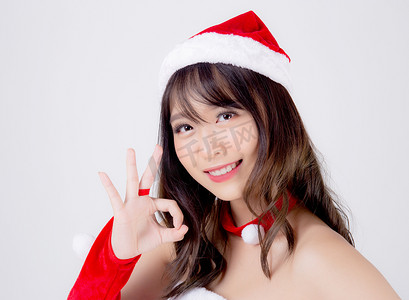美丽的肖像年轻亚洲女人圣诞老人服装微笑 gestu