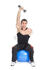 人坐姿摄影照片_Fitnes 球上的坐姿哑铃单臂三头肌伸展，阶段