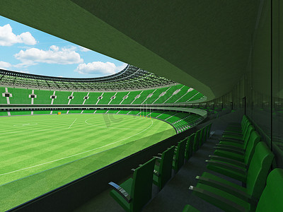 垂直俯拍足球场摄影照片_漂亮的现代圆形澳式足球场，设有绿色座椅和贵宾包厢