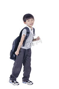 快乐校园摄影照片_快乐聪明的男孩准备上学