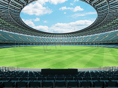 美丽的现代圆形澳式足球场，设有天蓝色座椅和贵宾包厢
