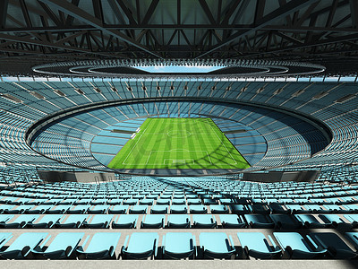 垂直俯拍足球场摄影照片_有天蓝色位子和贵宾包厢的大美丽的现代足球场
