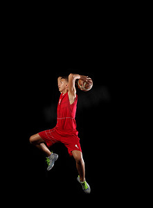 冠军季奖牌摄影照片_有球的篮球运动员