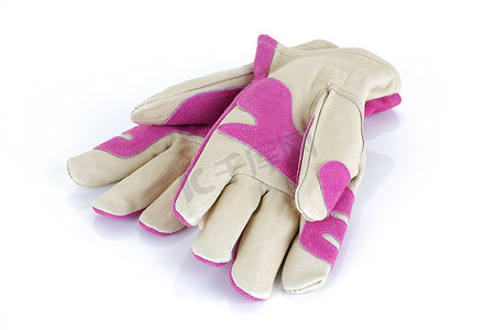 粉色夏天背景摄影照片_孤立在白色背景上的粉红色花园手套