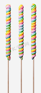 有五颜六色的彩虹漩涡的三个长的棒棒糖