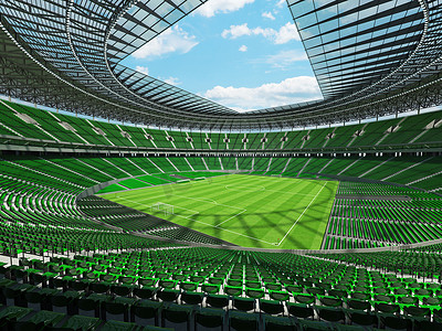 垂直俯拍足球场摄影照片_有绿色位子和贵宾包厢的大美丽的现代足球场