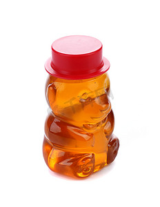 瓶子形状像一只熊，里面装满了蜂蜜。