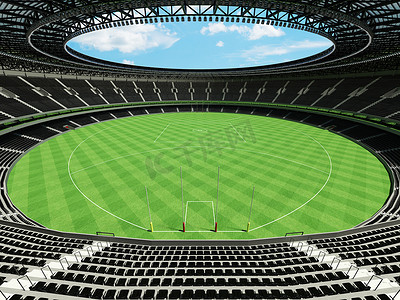 美丽的现代圆形澳式足球场，设有黑色座椅和贵宾包厢