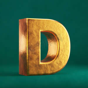 金色字母摄影照片_潮水绿色背景上的 Fortuna 金色字母 D 大写。