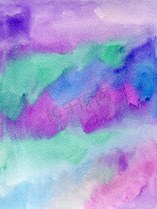 在纹理纸上用紫色、蓝色和绿松石色手绘水彩。