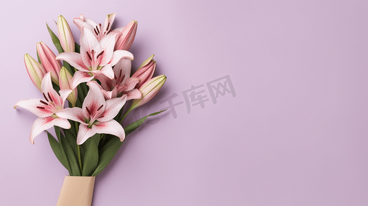 百合花束摄影照片_粉色百合花束放在粉色背景左侧
