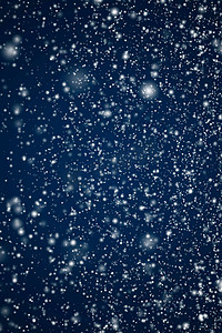 寒假和冬季背景，白雪落在深蓝色背景上，雪花散景和降雪颗粒作为圣诞节和下雪假期设计的抽象下雪场景