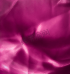 丝绸波浪线摄影照片_粉红色抽象艺术背景、丝绸质地和波浪线在 mot