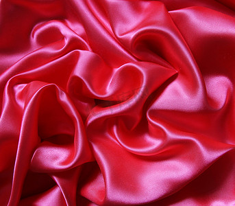 滑丝背景摄影照片_作为背景的光滑的典雅的红色丝绸