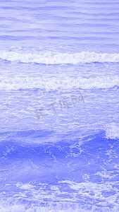 真实照片海水波浪，抽象背景，自然力量，淡淡的淡蓝色更多库存