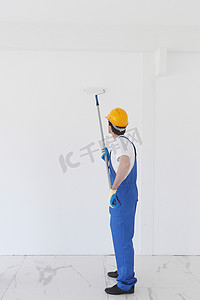 家杂摄影照片_工人粉刷墙