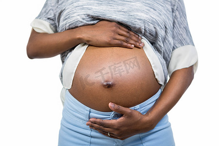 接触方式摄影照片_接触她的腹部的孕妇