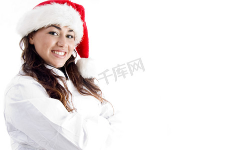 圣诞帽服装摄影照片_戴着圣诞帽的微笑厨师