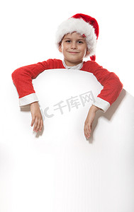 新年海报摄影照片_拿着圣诞海报的男孩